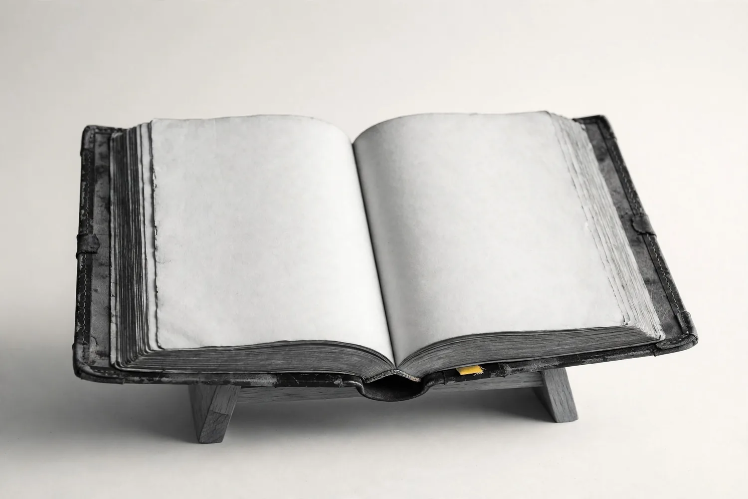 An open ledger on a book cradle